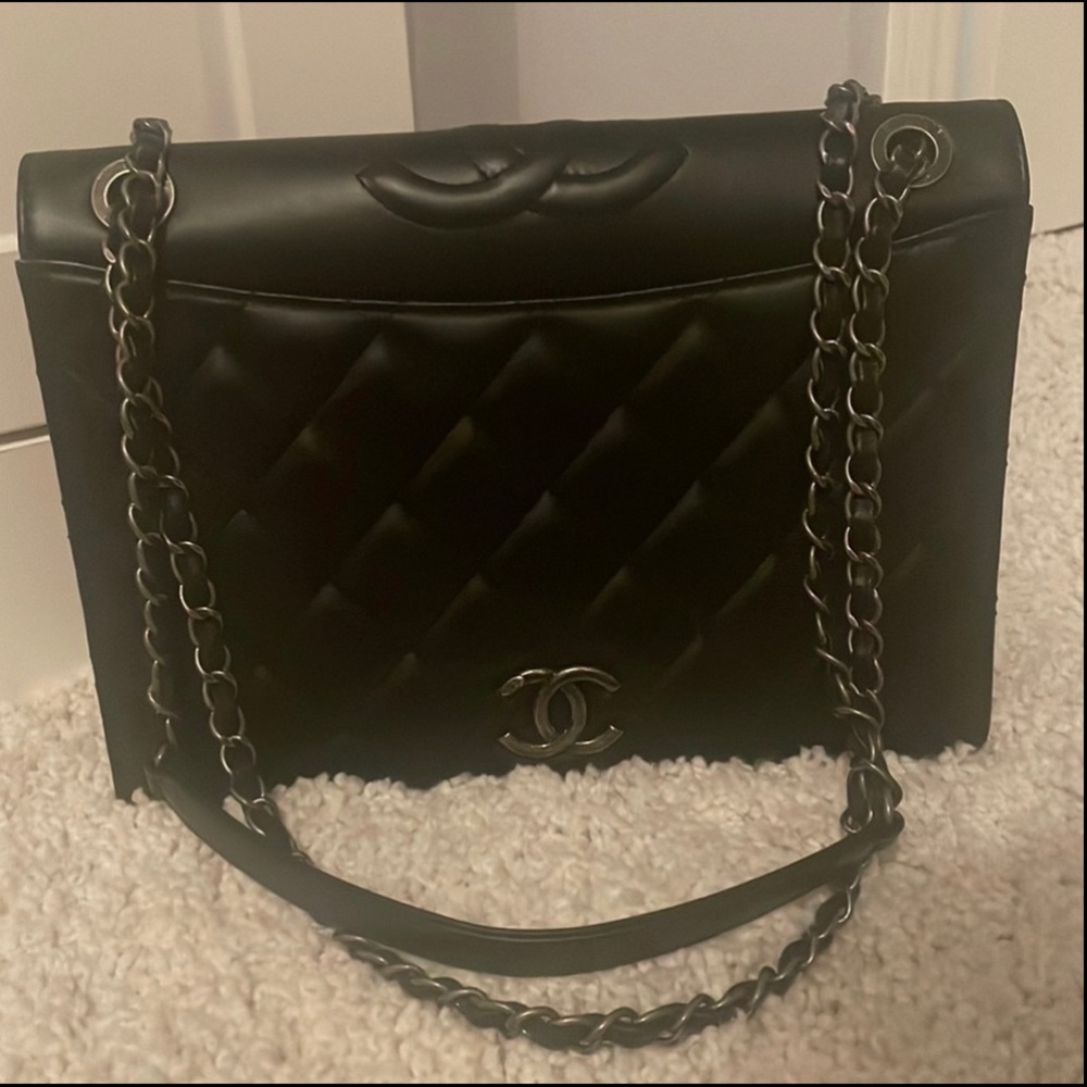 Black lambskin Chanel flap bag with ruthenium hardware